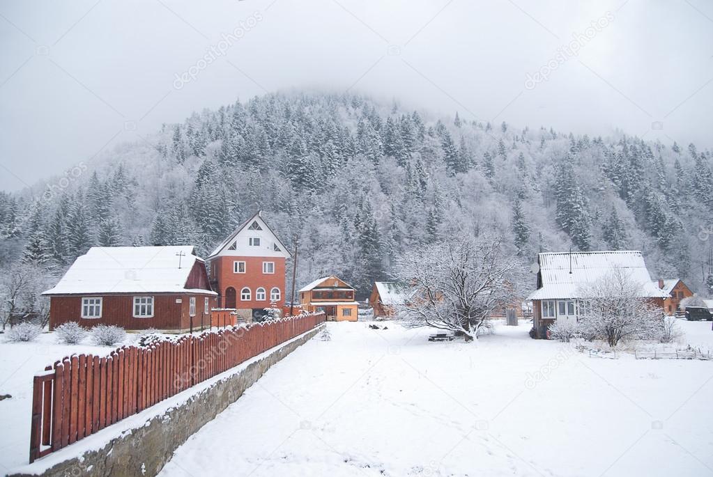 Beautiful village in winter mountains