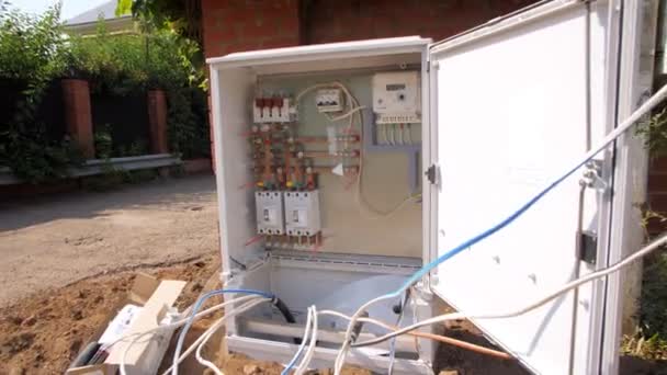 New switchbox with electrical equipment and cables on street — Stock Video