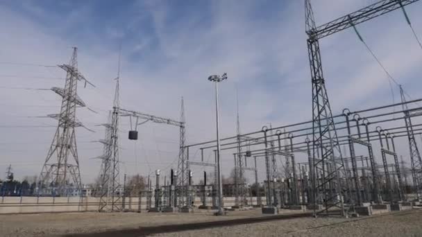 Towers with electricity transmission lines at substation — Stock Video