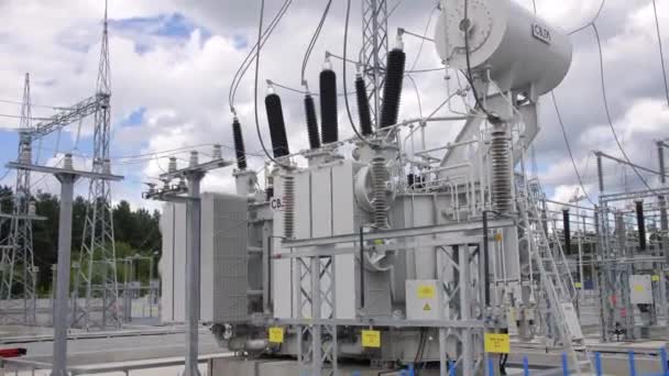 Transformer block with insulators and logo at substation — Stock Video