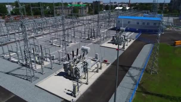 Power transformers with modern gear and building aerial view — Stock Video