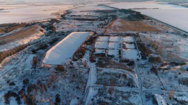 Constructions of wastewater treatment plant on snowy land — Stock Video