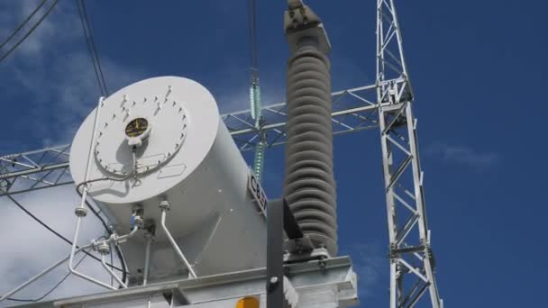 Conservator with logo on power transformer at substation — Stock Video