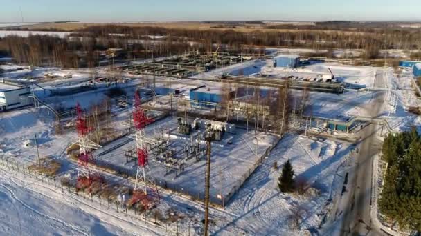 Electricity production substation against forest in winter — Stock Video