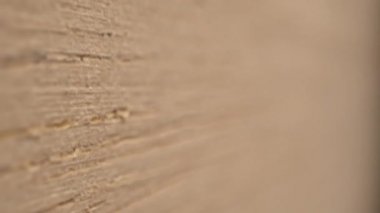 Motion up along rustic wooden surface on blurred background
