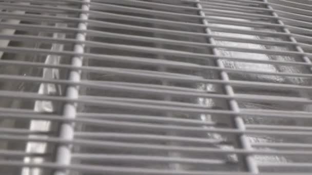 Metal grid of freon pipes fastened to domestic fridge back — Video Stock