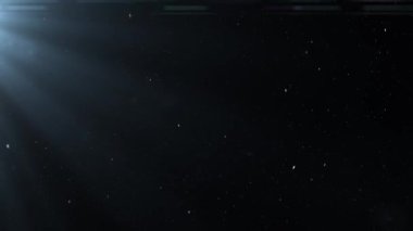 Işık saçan ışınların arka planına kar taneleri düşüyor. Noel süslemesi