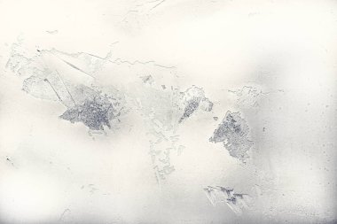 Geçmişi. Harap olmuş alçılı kirli beyaz duvar parçası.