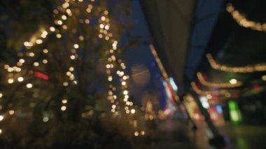 Golden and red warm bokeh lights on a dark background softly blurred circles of light festive cozy atmosphere 