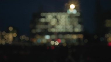 Golden and red warm bokeh lights on a dark background softly blurred circles of light festive cozy atmosphere 