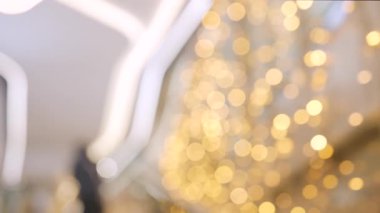 Golden and red warm bokeh lights on a dark background softly blurred circles of light festive cozy atmosphere