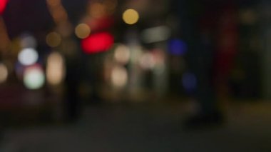 Golden and red warm bokeh lights on a dark background softly blurred circles of light festive cozy atmosphere
