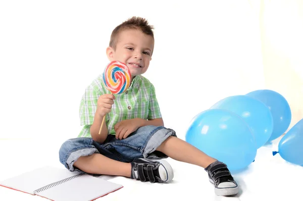 Blond boy with lollipop in her mouth — Stock Photo, Image