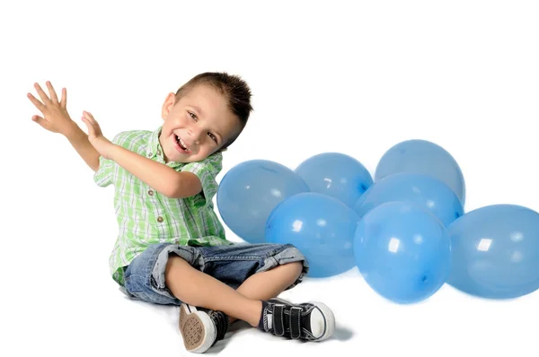 Blond boy with balloons on white background — Stock Photo, Image