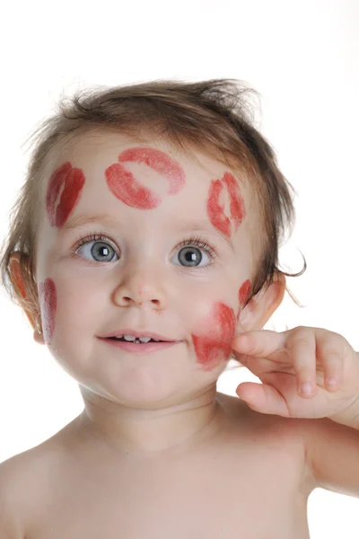 Sweet baby, with traces of kisses on his face — Stock Photo, Image