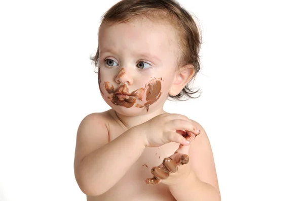 Bebê desfrutando alegremente com chocolate — Fotografia de Stock