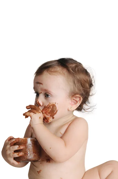 Bebê aproveitando o momento, comendo chocolate — Fotografia de Stock