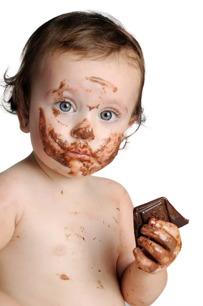 Baby genieten van het moment, het eten van chocolade — Stockfoto