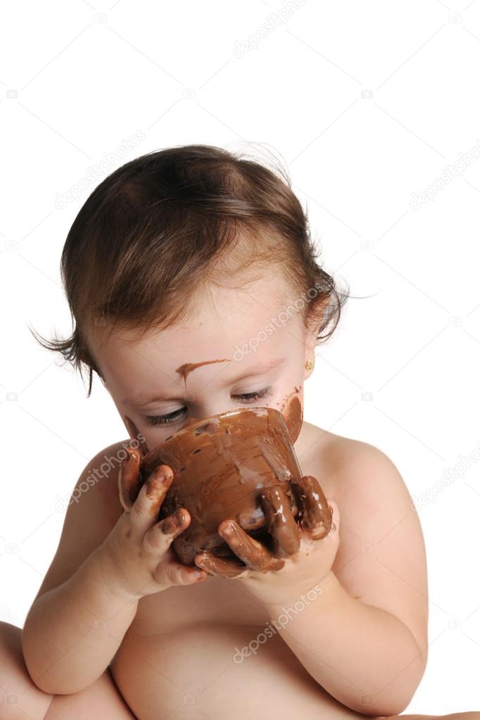 Baby enjoying the moment, eating chocolate