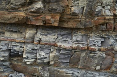 Taşların dokusu ve arkaplanı. Deniz kıyısındaki kaya dokusu