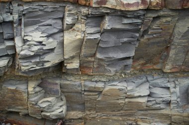 Taşların dokusu ve arkaplanı. Deniz kıyısındaki kaya dokusu