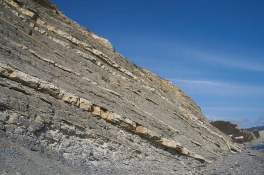 Taşların dokusu ve arkaplanı. Deniz kıyısındaki kaya dokusu
