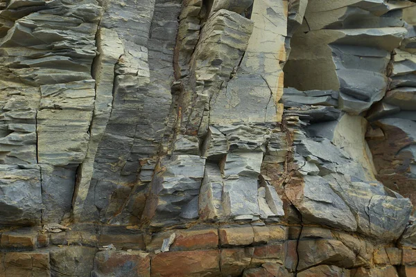 Taşların dokusu ve arkaplanı. Deniz kıyısındaki kaya dokusu — Stok fotoğraf
