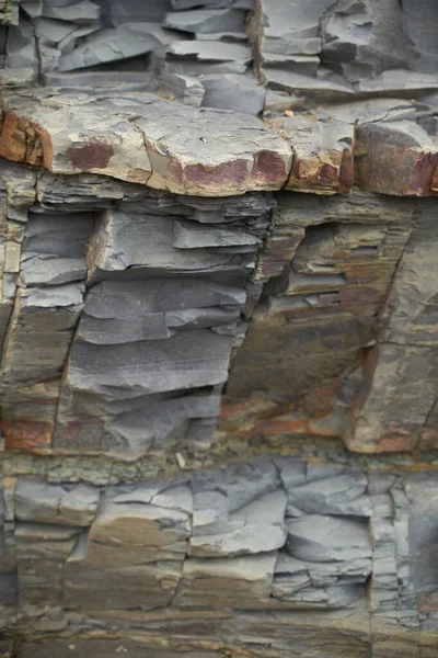 The texture and background of the stones. Rock texture on the sea coast — Stock Photo, Image