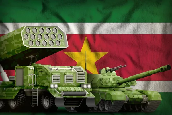 tank and rocket launcher with summer pixel camouflage on the Suriname flag background. Suriname heavy military armored vehicles concept. 3d Illustration