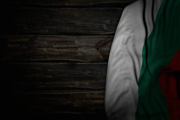 nice dark photo of Bulgaria flag with big folds on old wood with empty space for content - any feast flag 3d illustration