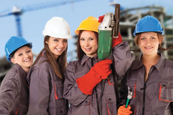 Quatro mulheres trabalhadoras da construção — Fotografia de Stock