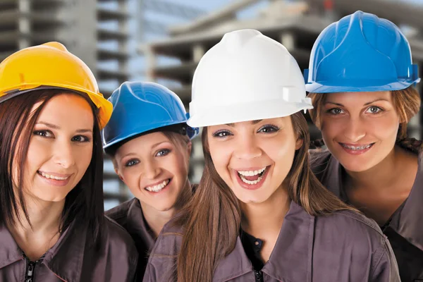 Equipe sorridente trabalhadores da construção feminina — Fotografia de Stock