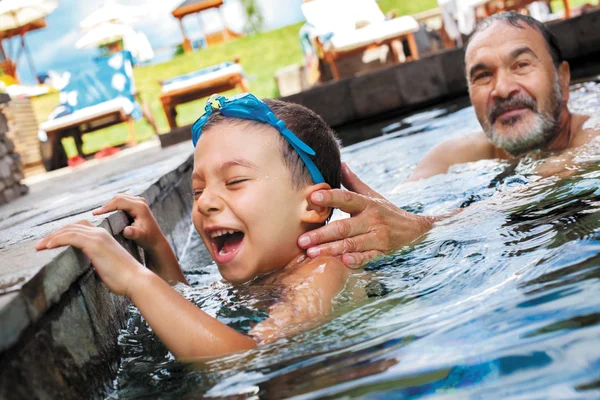 Laughter boy grandfather pool — Stock Photo, Image