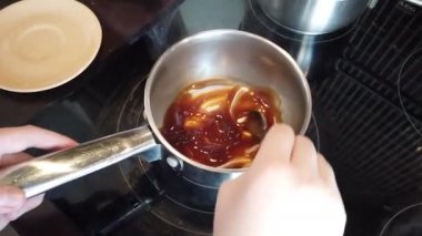 Close-up Boy Hands cooking sauce. Sauce prepairing. Chef Preparing food