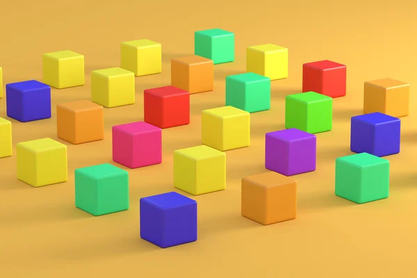 Барвисті яскраві кубики на помаранчевому фоні — стокове фото