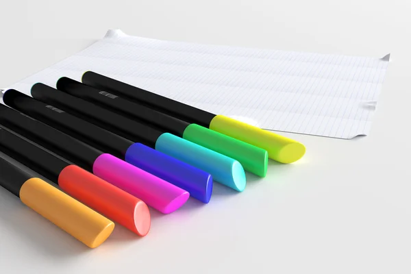 Красочные ручки с листом бумаги — стоковое фото