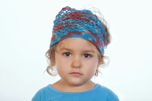 Adorable calm girl looking at camera and wearing blue handmade headband — Stock Photo, Image