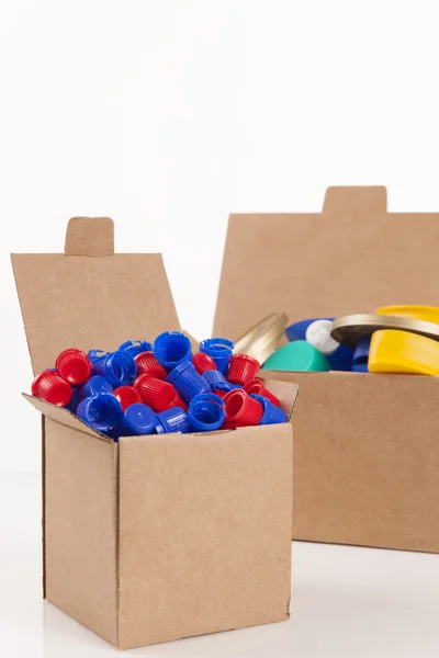 Box and caps — Stock Photo, Image