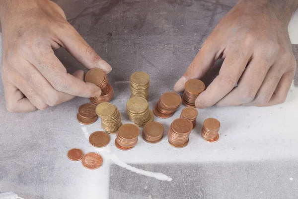 A poor hands taking some coins — Stock Photo, Image