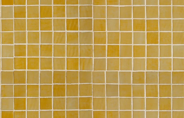 Primer plano de azulejo acristalado amarillo decorativo. Textura inclinable —  Fotos de Stock