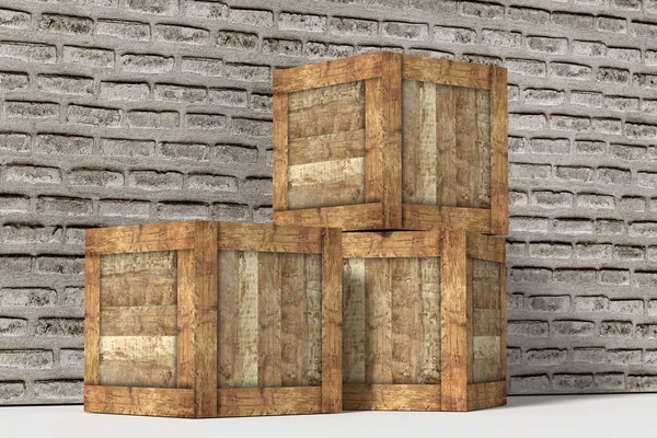 Three wooden boxes near brick wall — Stock Photo, Image