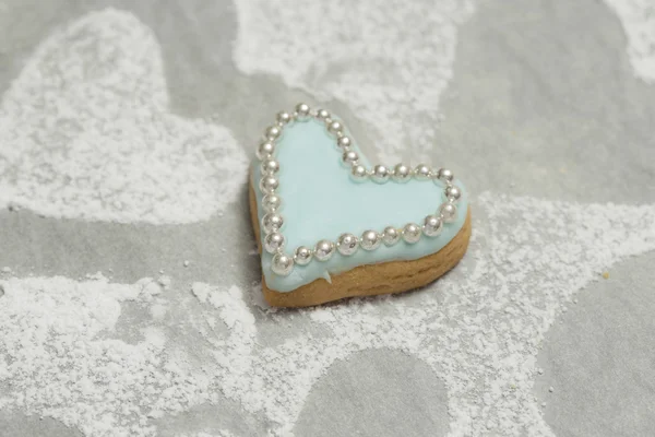 Close-up of delicious cookie with blue icing and edible beads — Stock Photo, Image