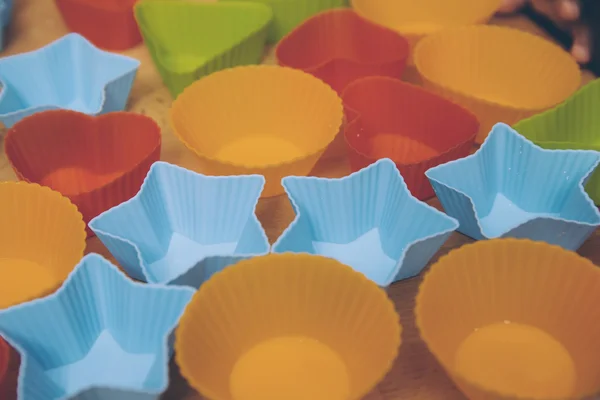 Different baking forms on table — Stock Photo, Image