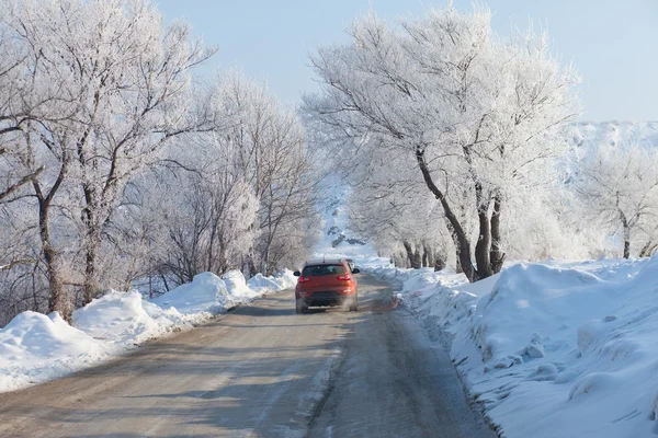 Car moving on beautiful winter road — Stock Photo, Image