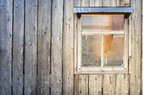 Wooden background. Wall of a barn with a window — Stock Photo, Image