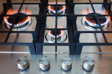 Gas stove with burning flame clipart