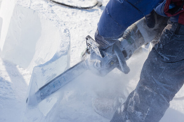 KHABAROVSK, RUSSIA - JANUARY 23,  2016: Sculptor working on ice 