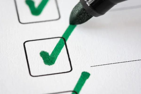 Checklist with a pen — Stock Photo, Image