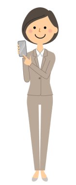 Akıllı telefonlu takım elbiseli bir kadın. Elinde akıllı telefon tutan takım elbiseli bir kadının resmi..