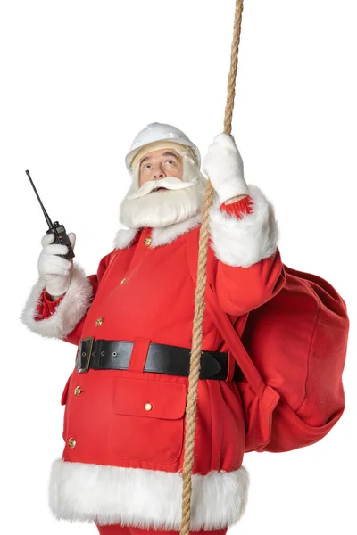 İşçi Noel Baba elinde telsizle ip tutuyor. Mutlu Noeller ve mutlu yıllar.!